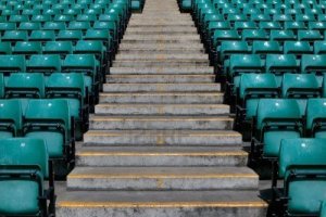3882117-numbered-steps-in-a-sports-stadium-in-between-the-green-pastic-seating